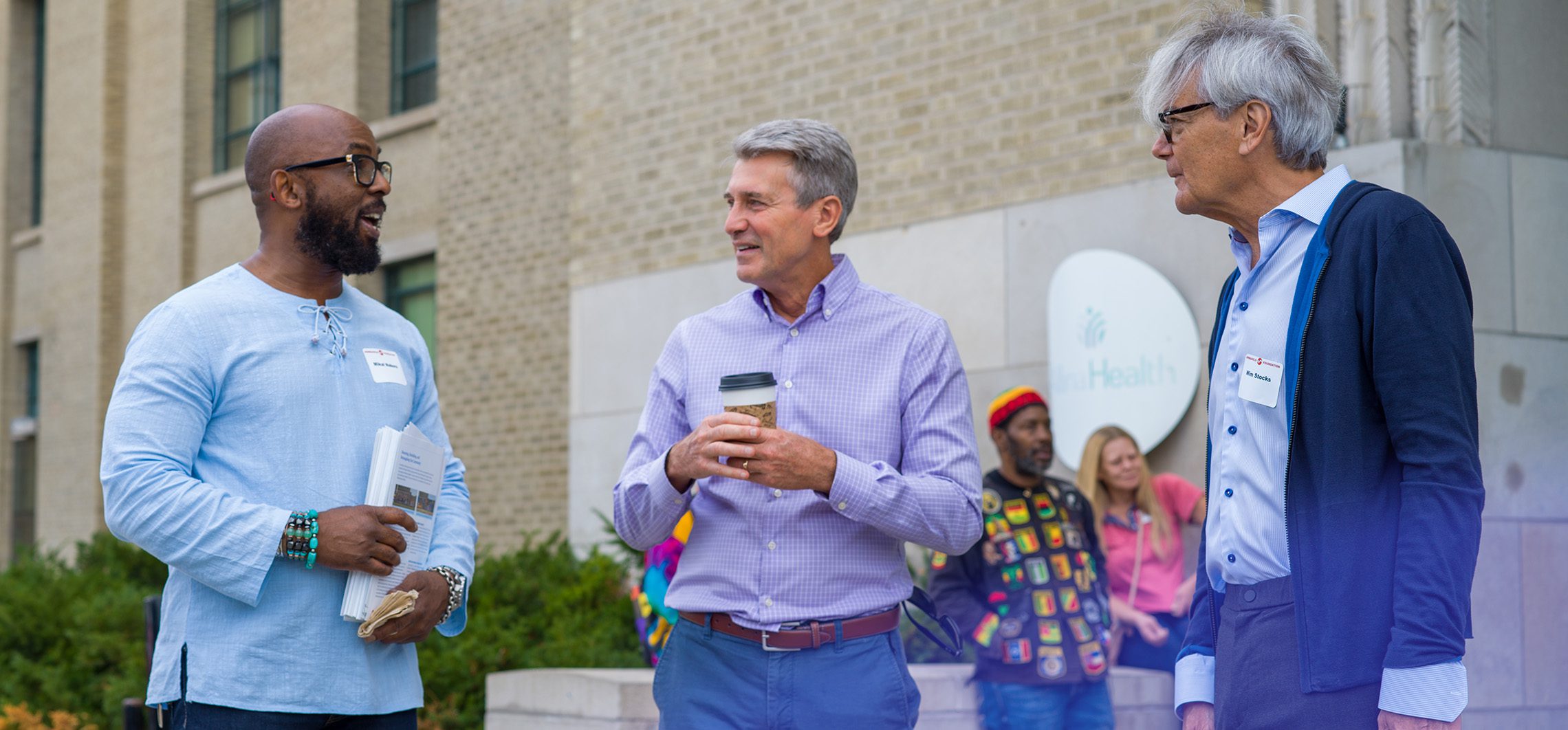 Minneapolis Foundation staff talking in front of the Midtown Global Market